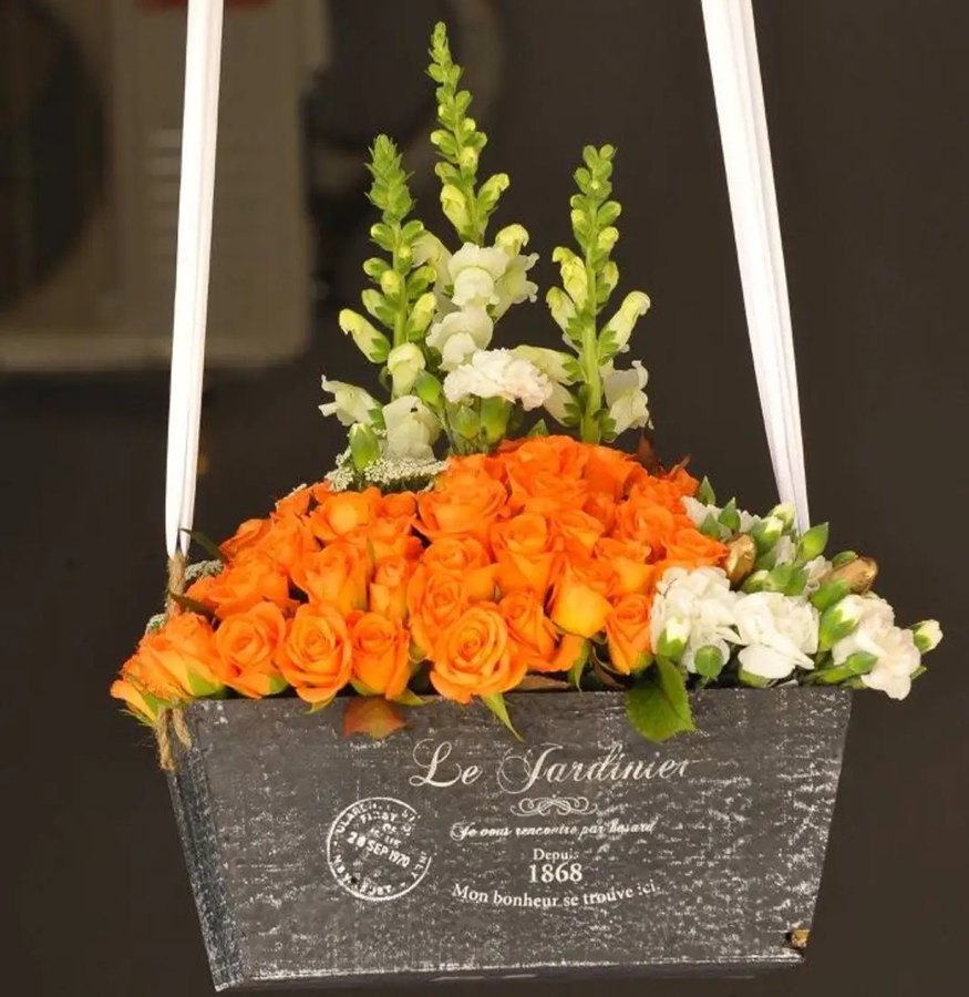 Hanging garden box of orange roses